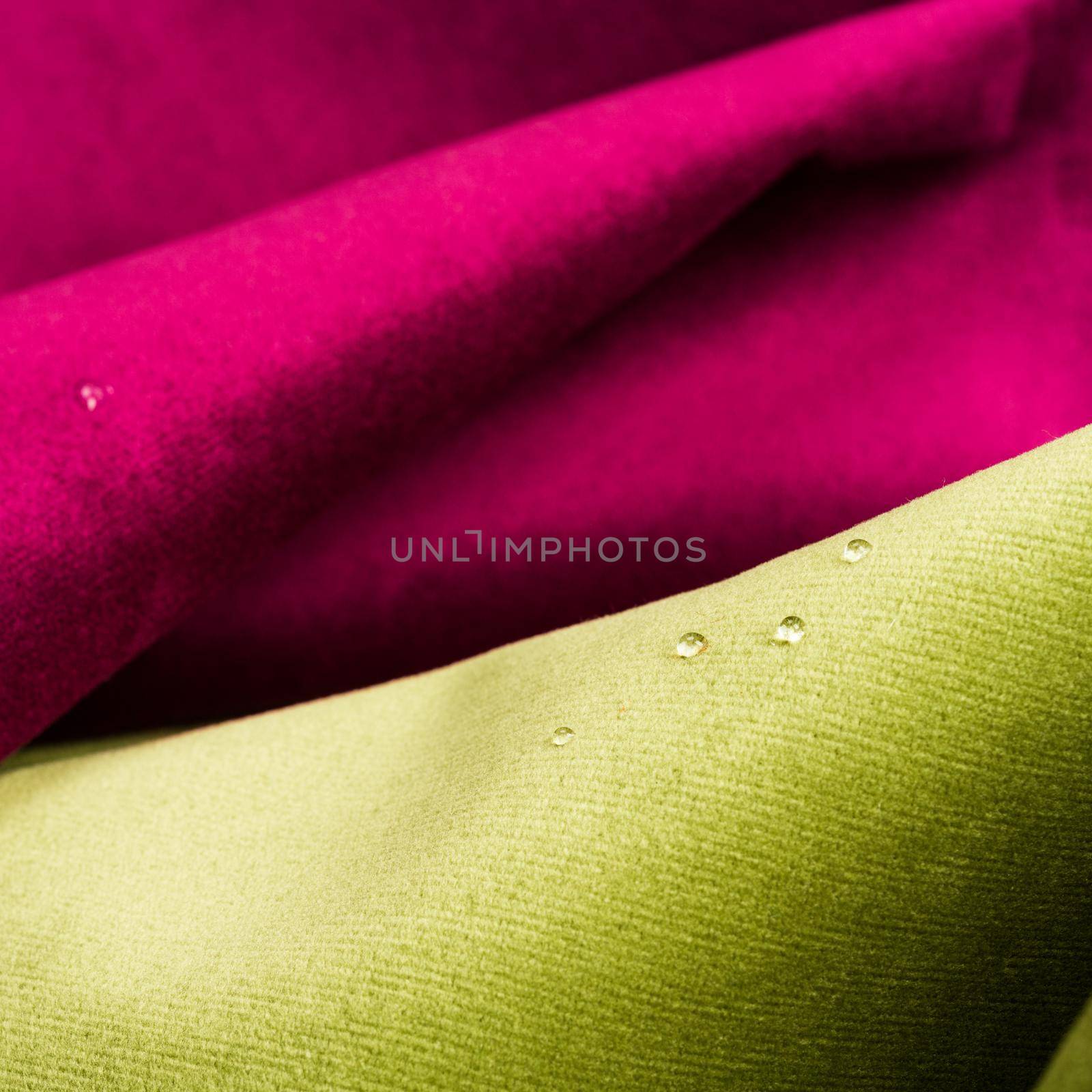 Macro shot of fine fabric texture background with water drops