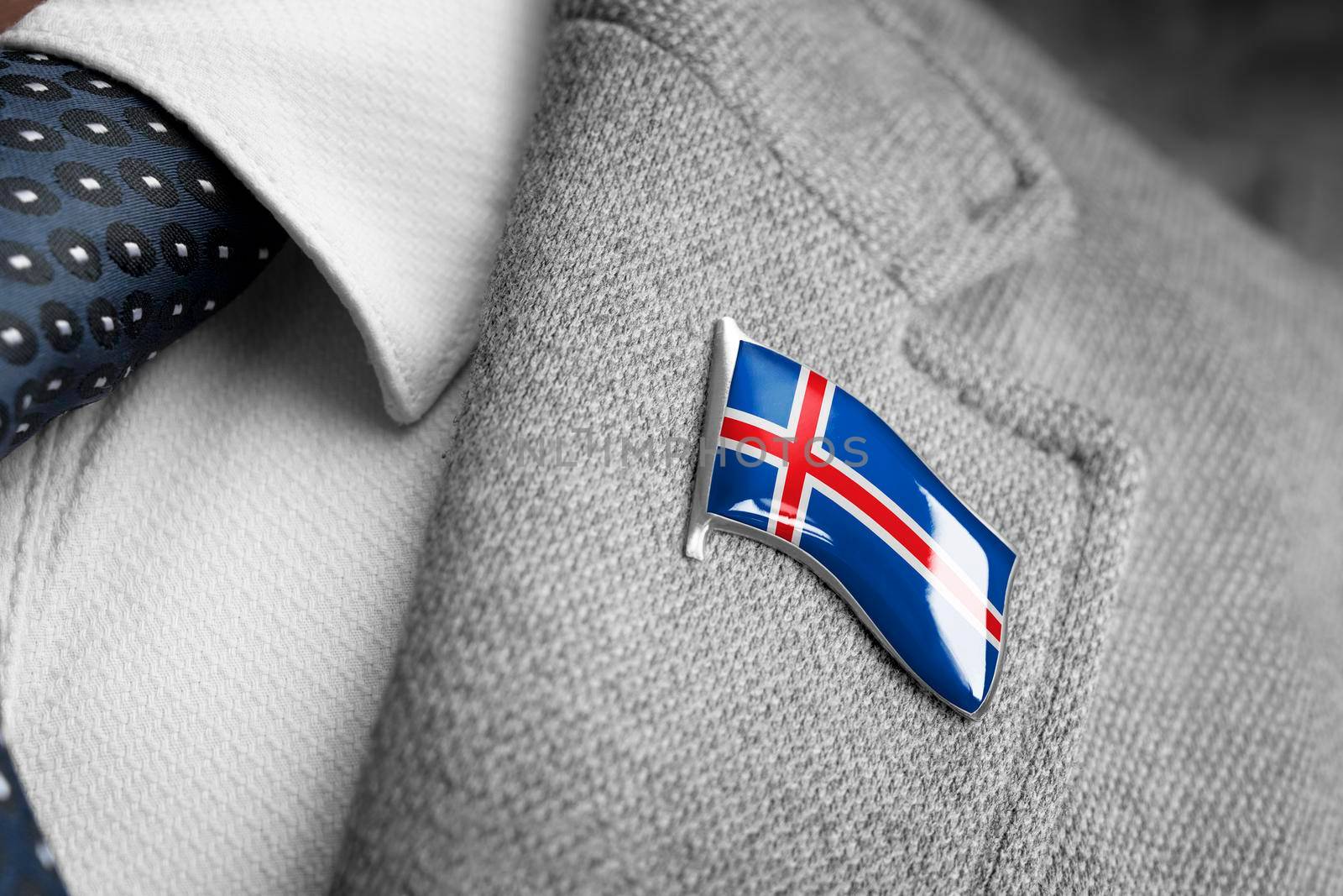 Metal badge with the flag of Iceland on a suit lapel.