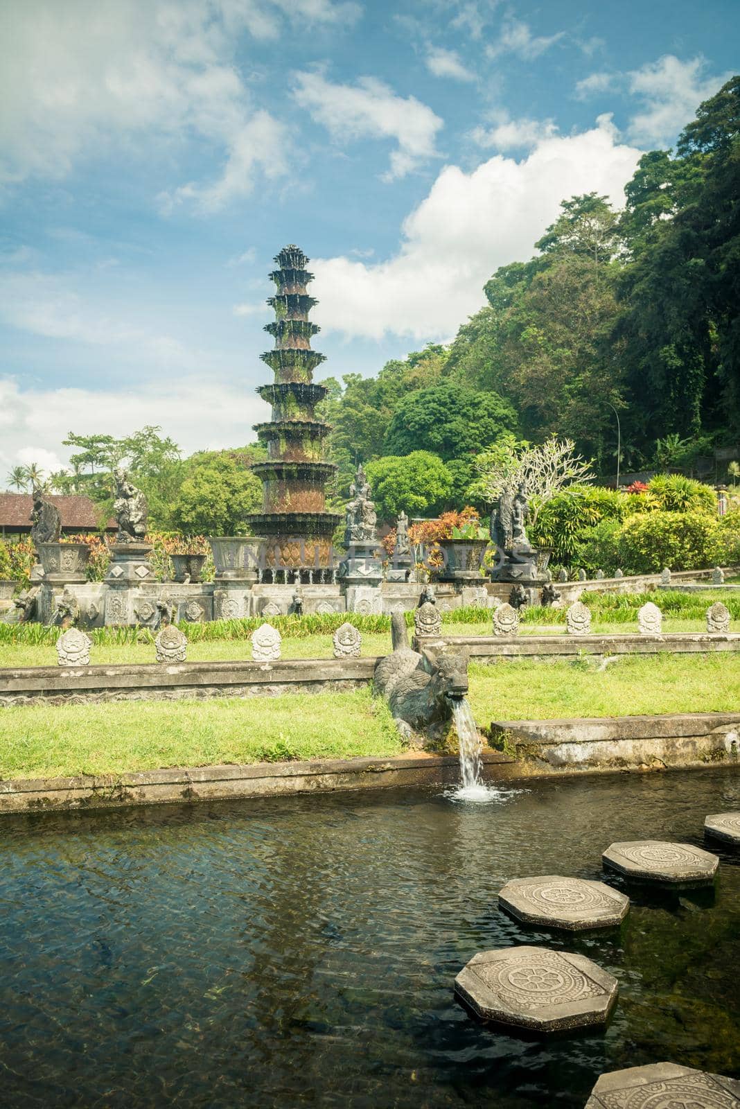 Tirtagangga water palace with fountains and ponds on Bali, Indonesia