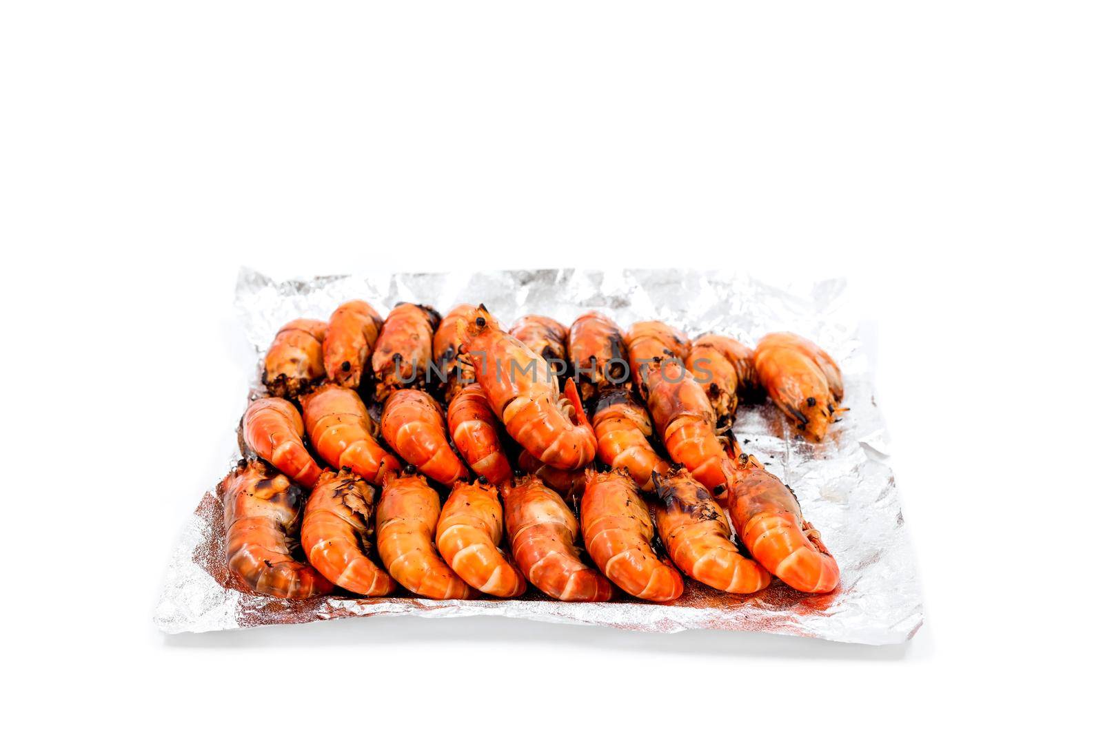 Arrange grilled river prawns on foil to deliver to customers ordering food online. by wattanaphob