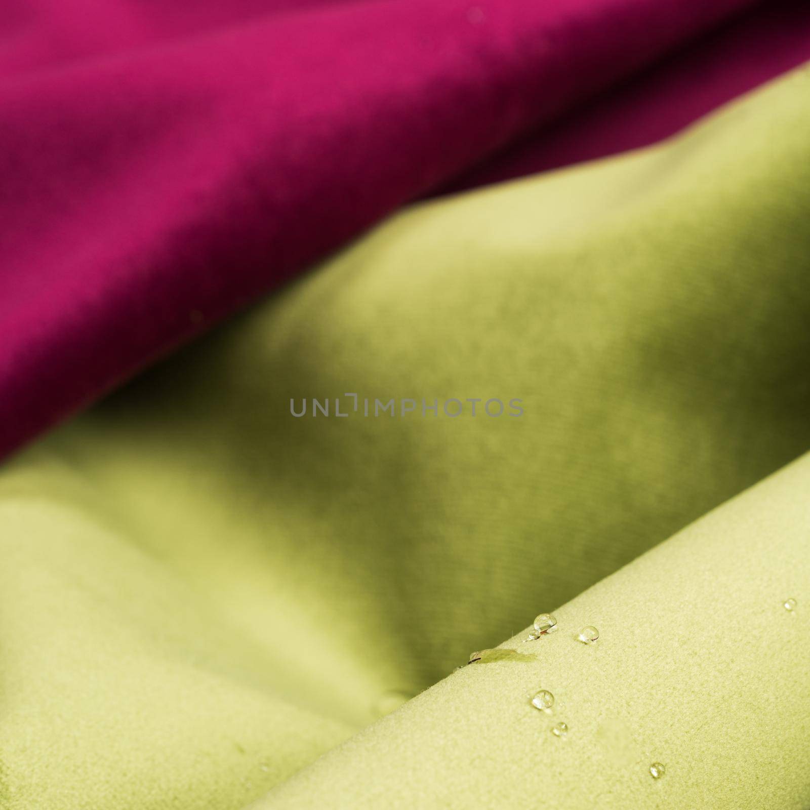 Macro shot of fine fabric texture background with water drops