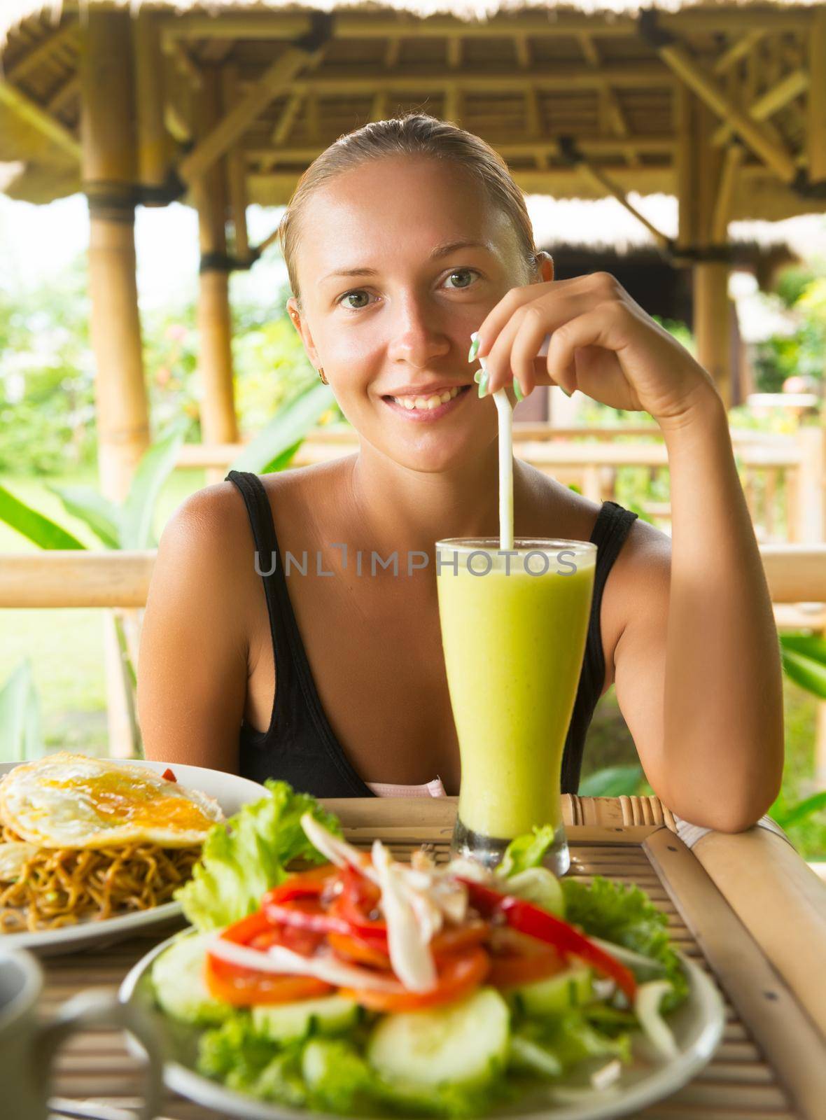 Young woman having healthy organic lunch in Bali