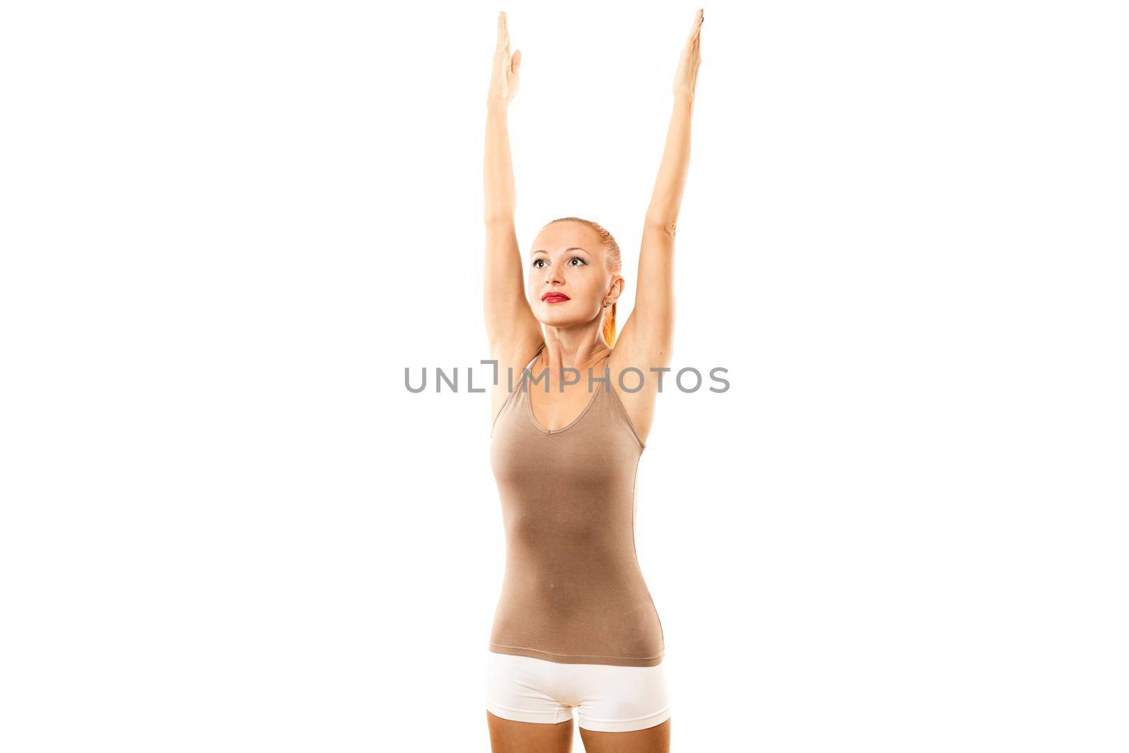 Young woman practicing yoga over white background