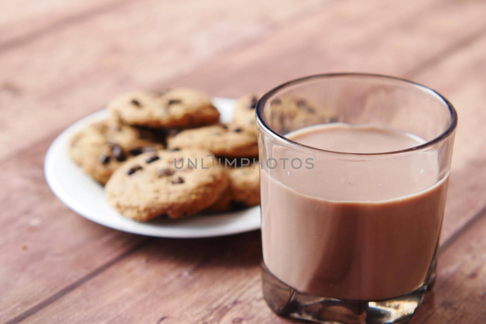 chocolate cooking and a glass of chocolate milkshake on table ,