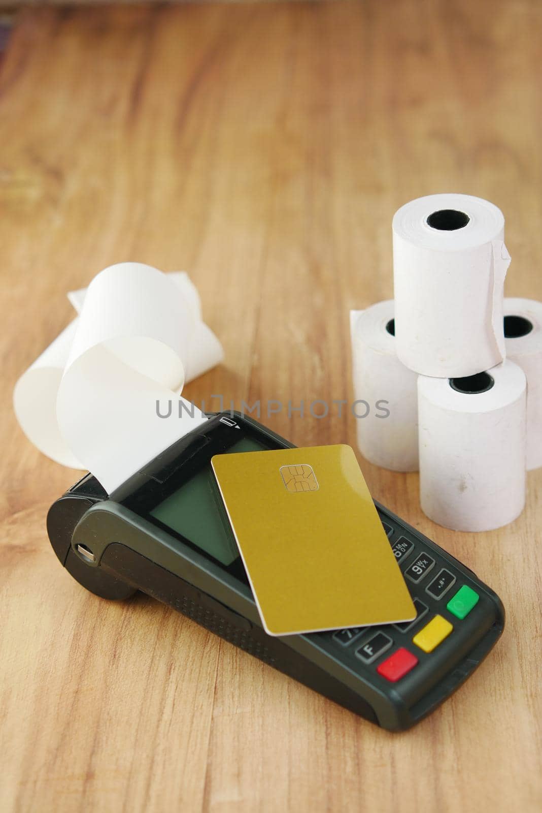 contactless payment concept with credit card and pos machine on table .