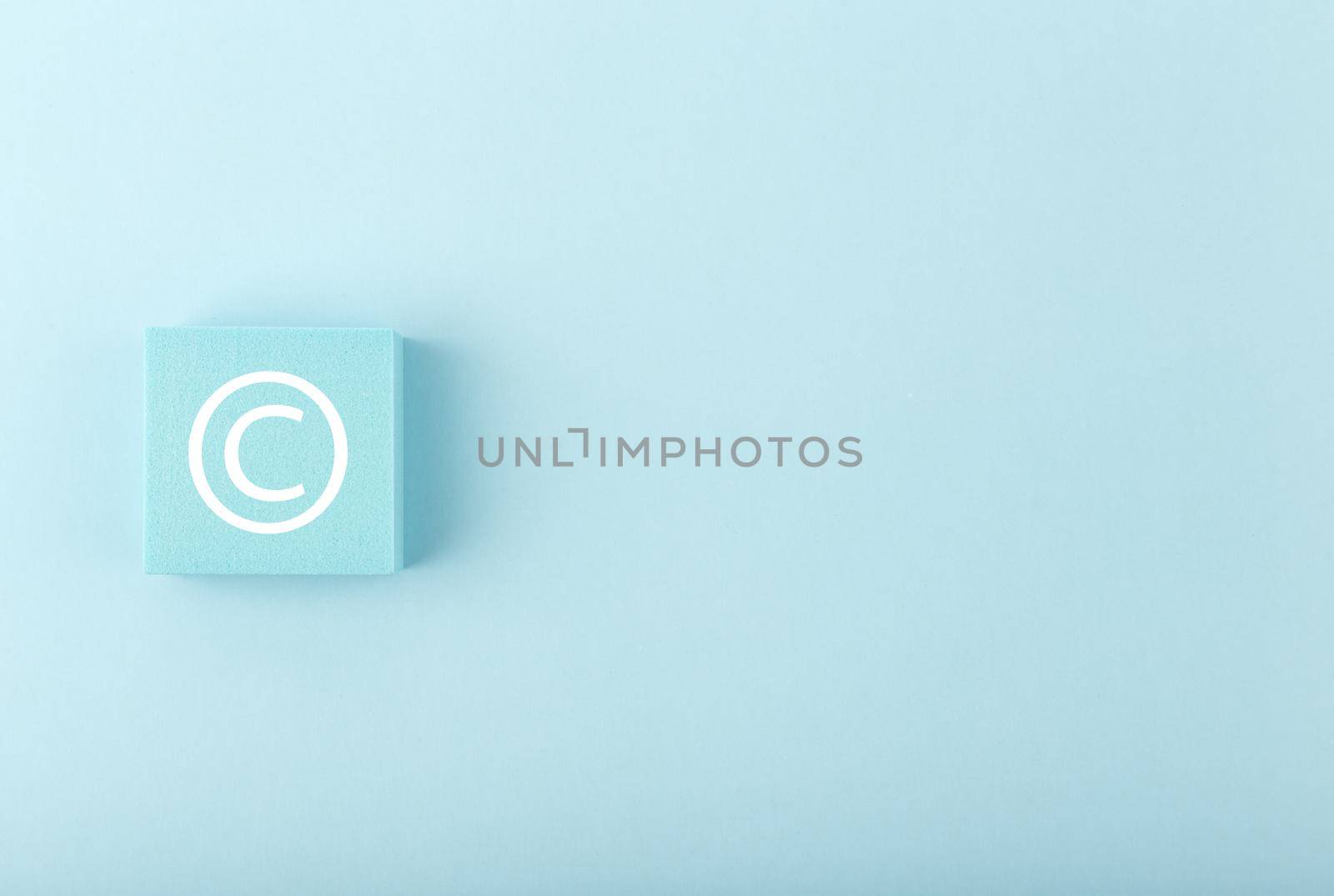 Minimal blue copyright protection concept on pink background with copy space by Senorina_Irina