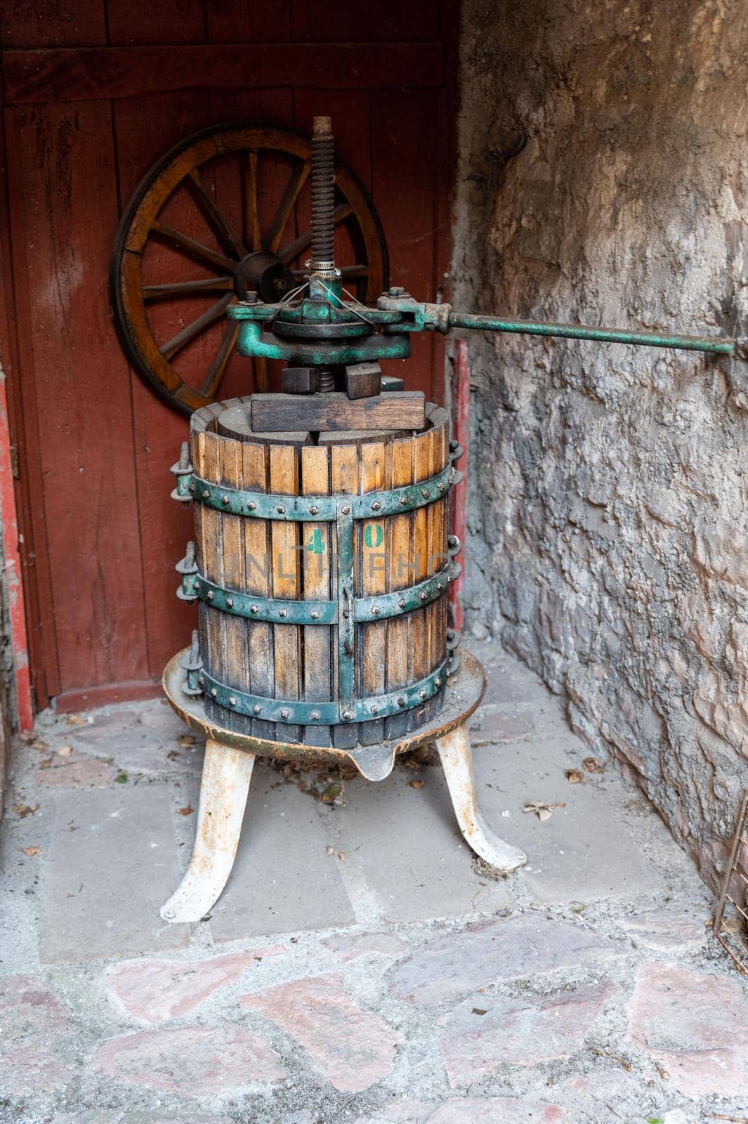 ancient press for crushing grapes for the production of wine