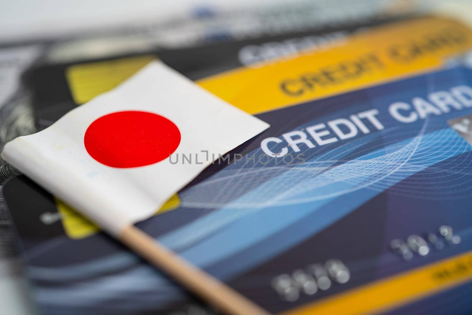Japan flag on credit card. Finance development, Banking Account, Statistics, Investment Analytic research data economy, Stock exchange trading, Business company concept.