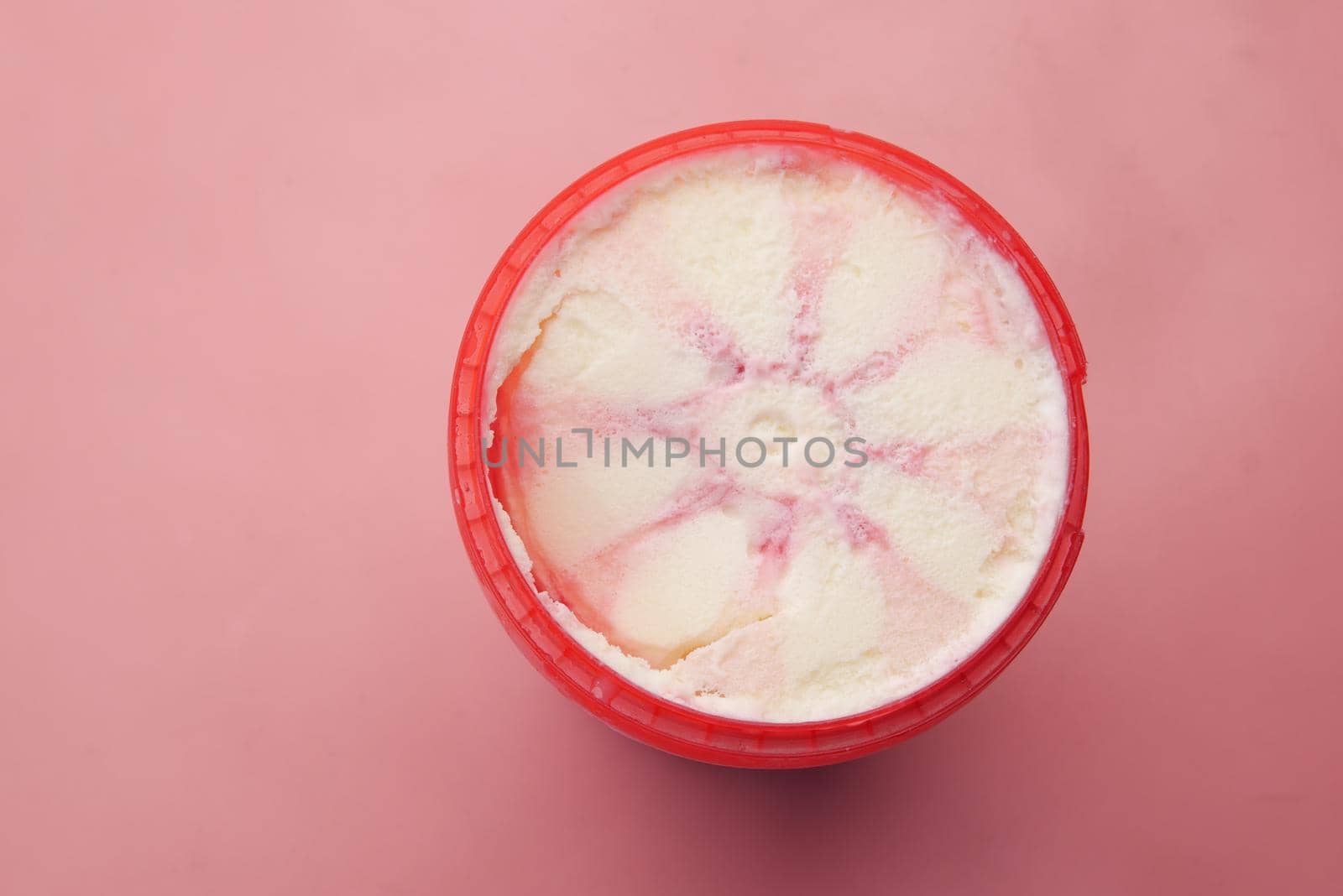 close up of vanila flavor ice cream in a container .