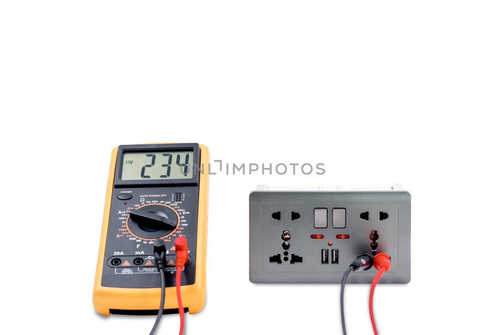 Using a digital meter to measure the voltage at an electric outlet socket box isolated on white background.