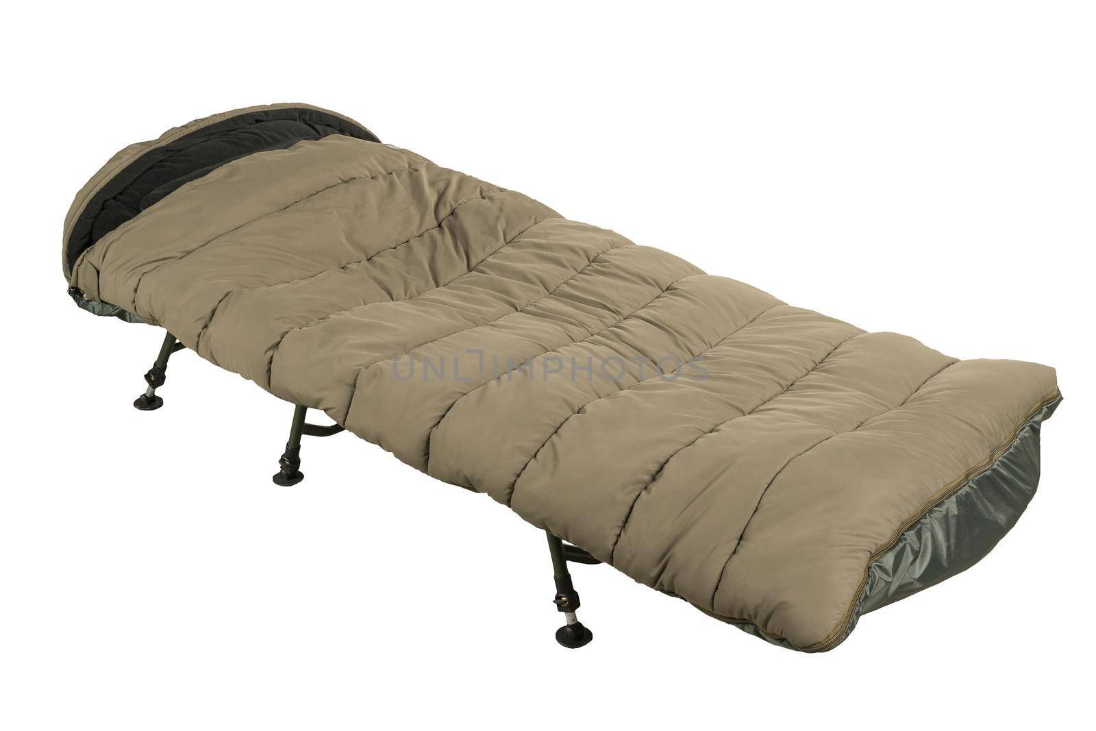 Green camp bed with sleeping bag isolated on white background