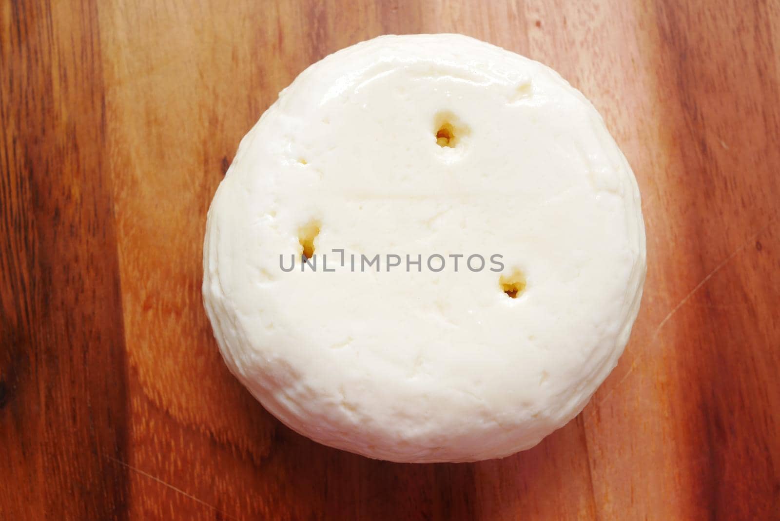 close up of fresh cheese on white background