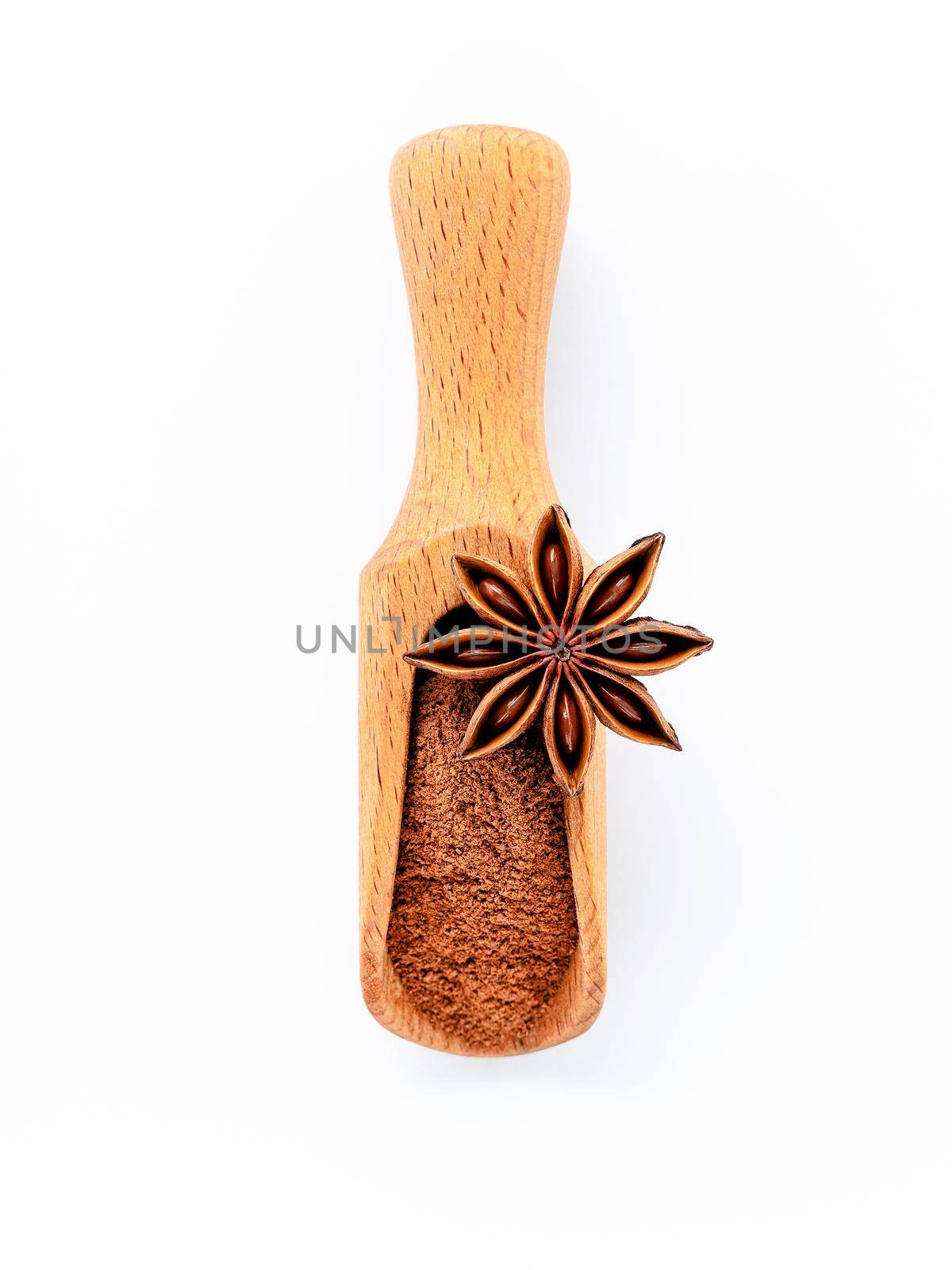 Close up chinese star anise in wooden scoop  isolate on white background. Dried star anise spice fruits top view and copy space. by kerdkanno