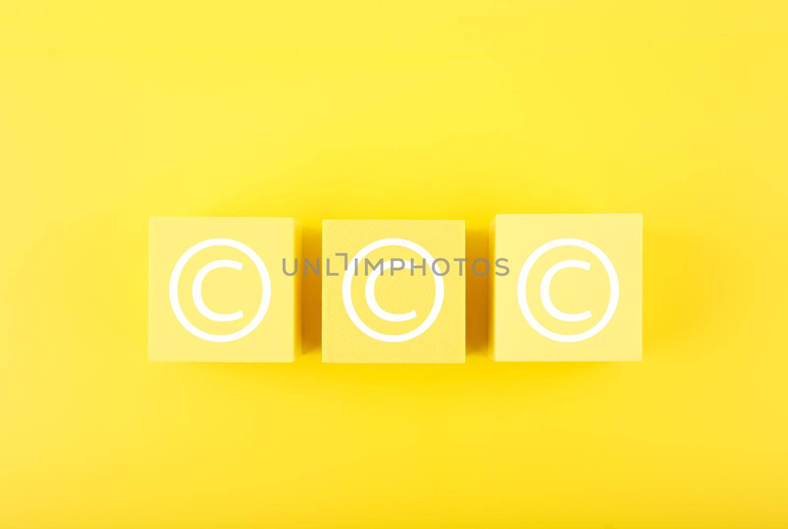 Copyright and intellectual property protection concept on yellow background  by Senorina_Irina