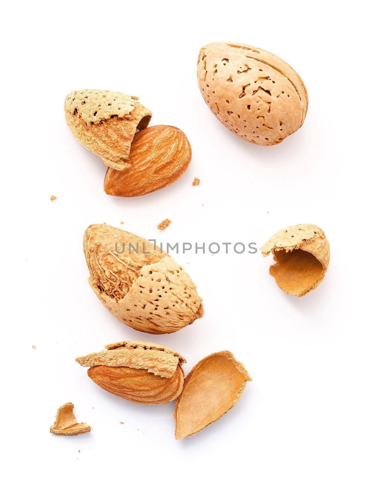 Close up group of almonds nut with shell  and cracked almonds shell isolated on white background. by kerdkanno