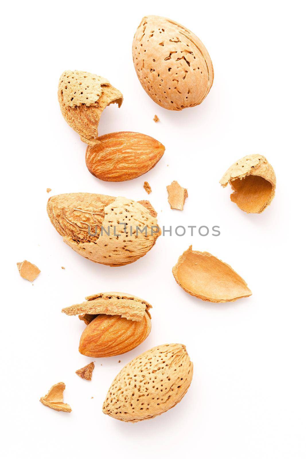 Close up group of almonds nut with shell  and cracked almonds shell isolated on white background. by kerdkanno