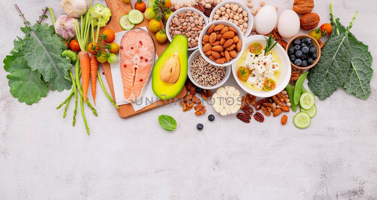 Ketogenic low carbs diet concept. Ingredients for healthy foods selection set up on white concrete background.  by kerdkanno