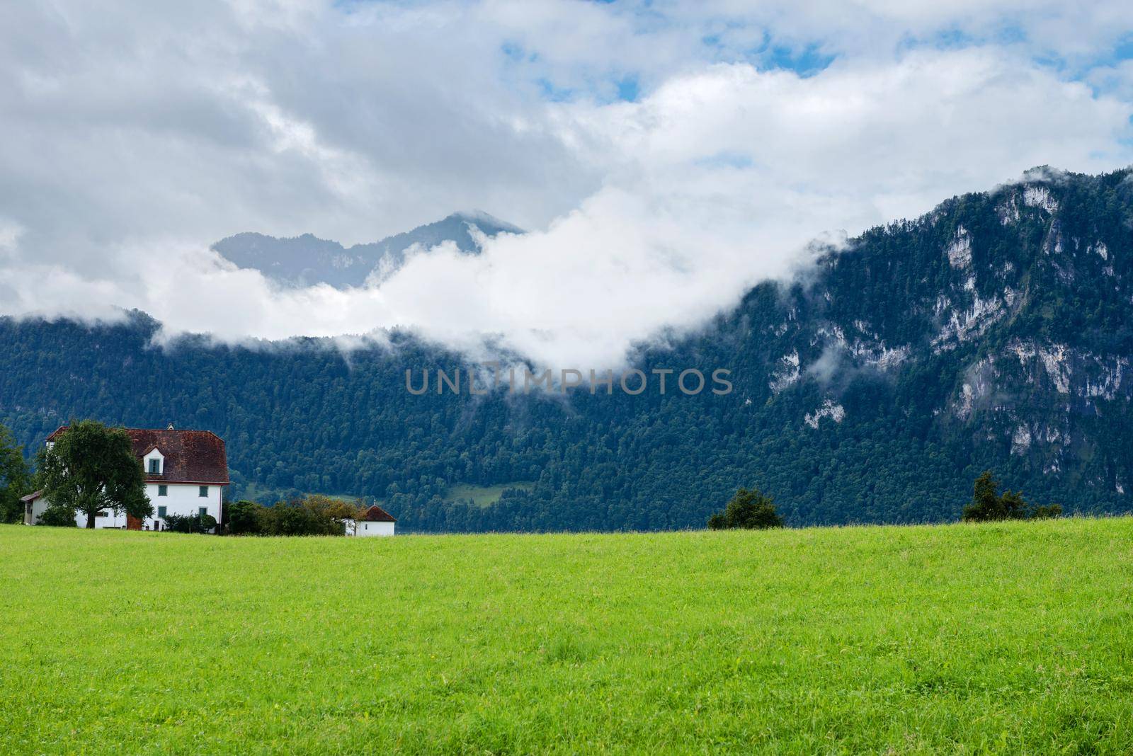 Beautiful mountains landscape in Switzerland Alps. Small house by anytka
