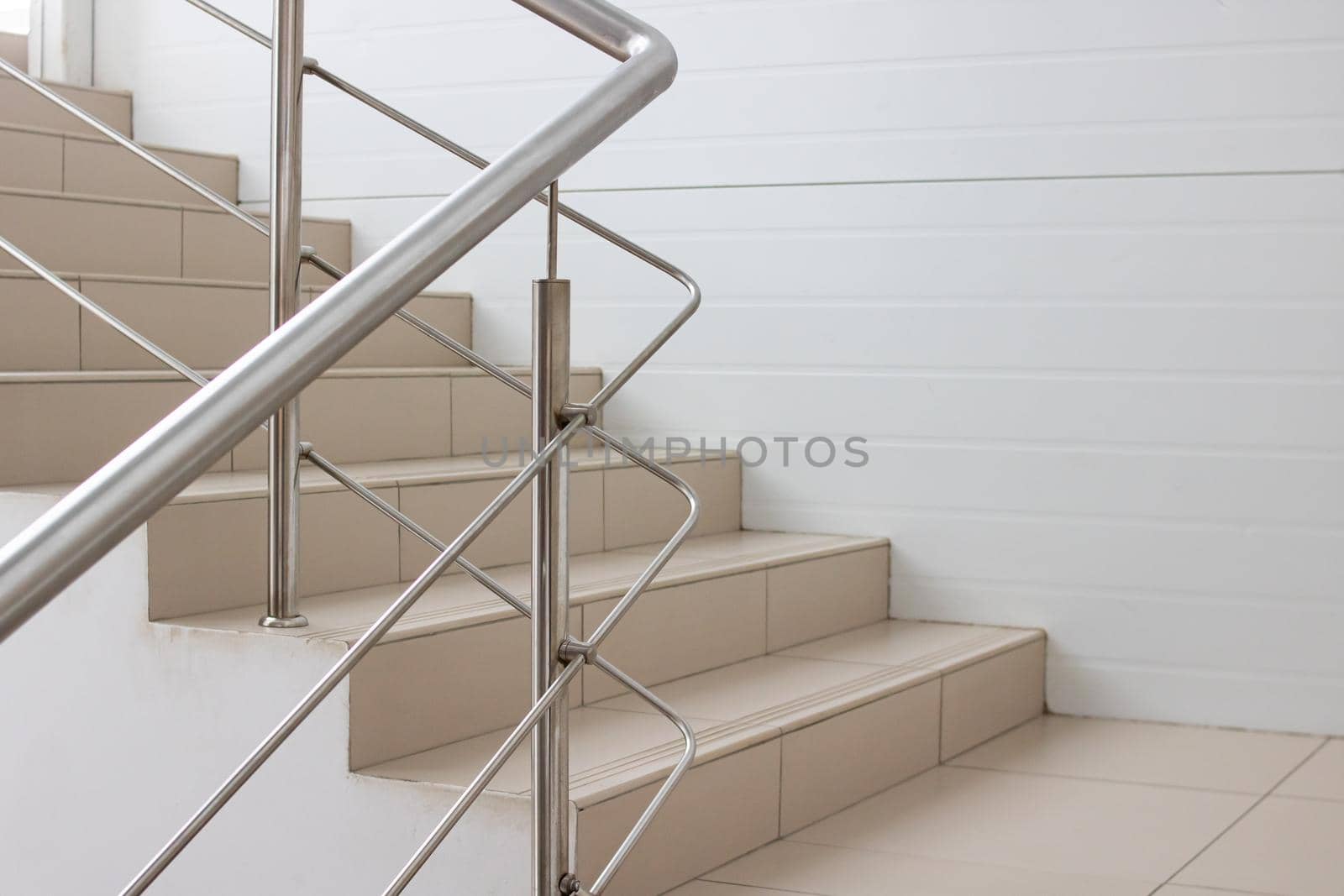 Brown staircase with metal railings close up indoor