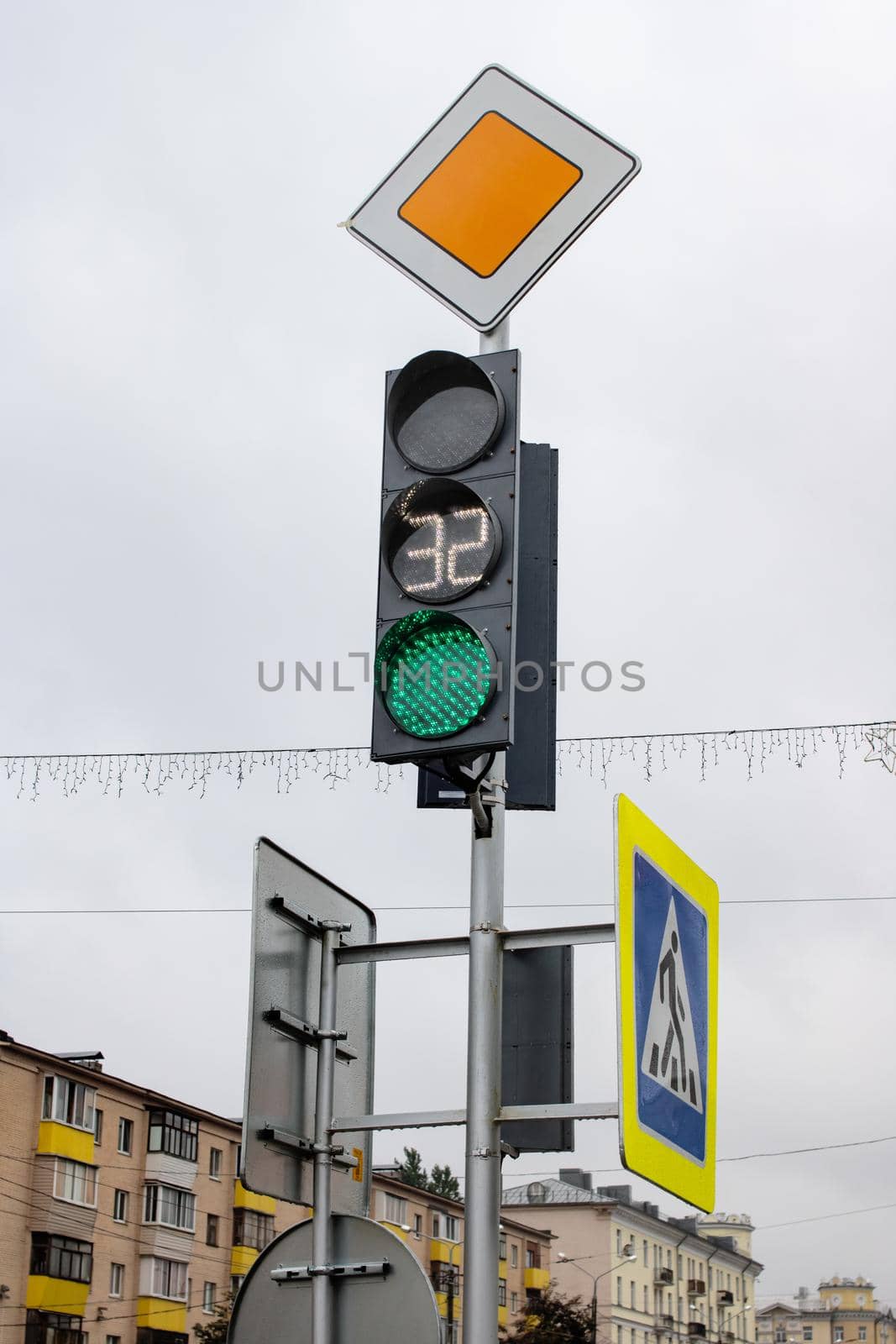 Green light at traffic light in city by Vera1703