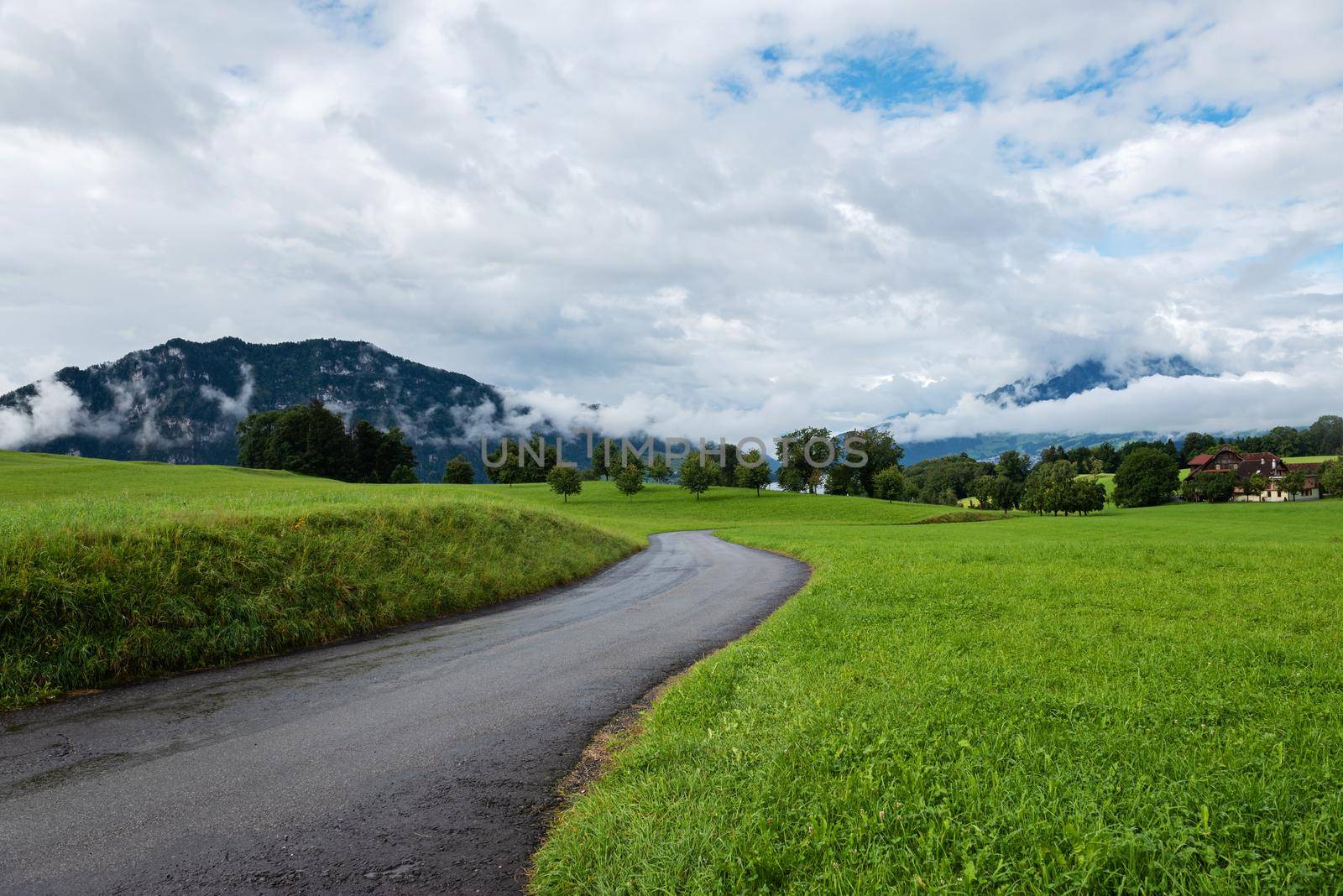 Beautiful mountains landscape in Switzerland Alps. Winding road.