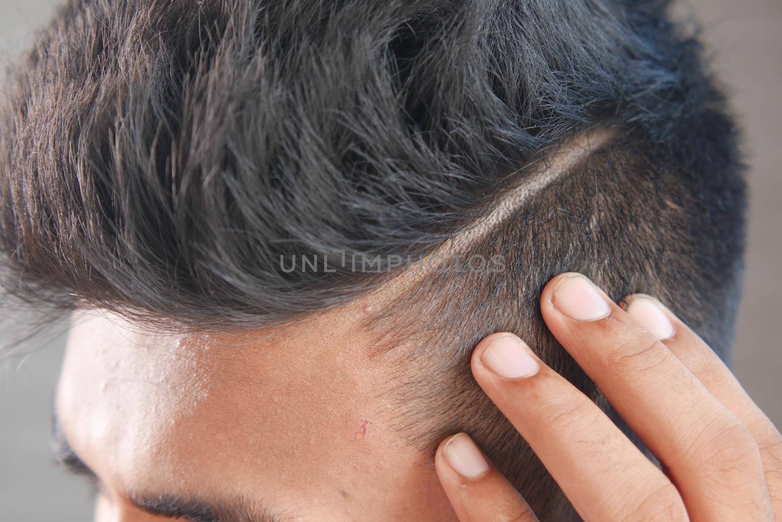 young man with styling hair close up ,