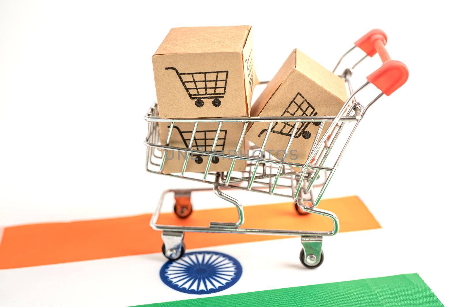 Box with shopping cart logo and India flag, Import Export Shopping online or eCommerce finance delivery service store product shipping, trade, supplier concept. by pamai