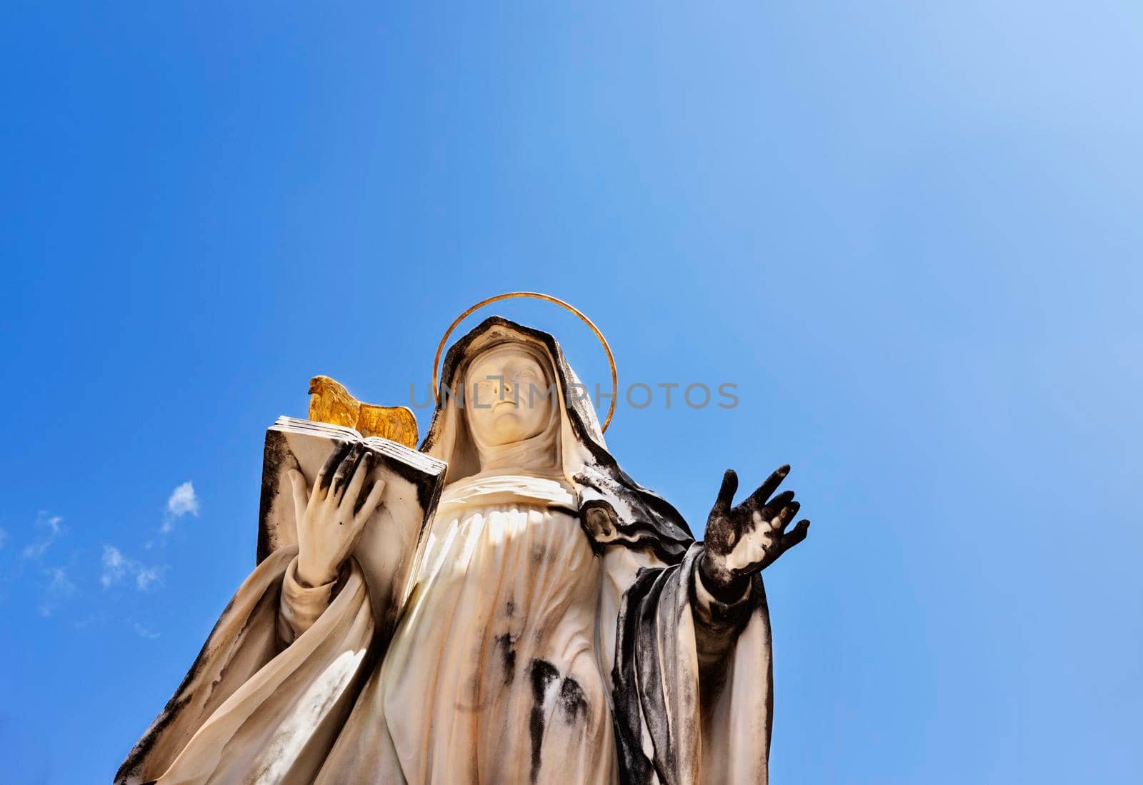 Montecassino Abbey -Italy - August 29 -2021-statue of St. Scolastica against blue sky  , Benedictine monastery 