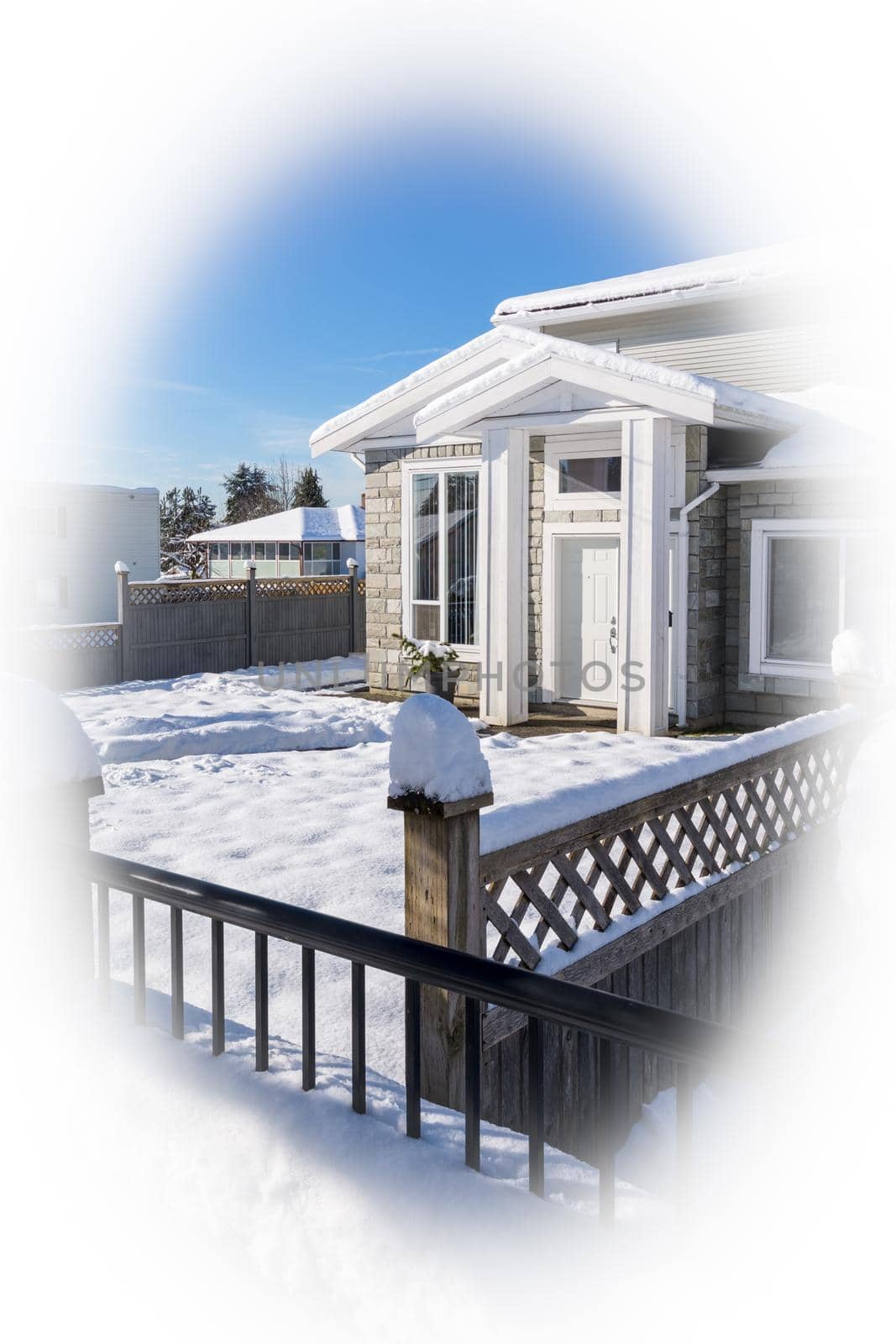 Main entrance of new residential house in snow on winter season in Canada. New house for sale
