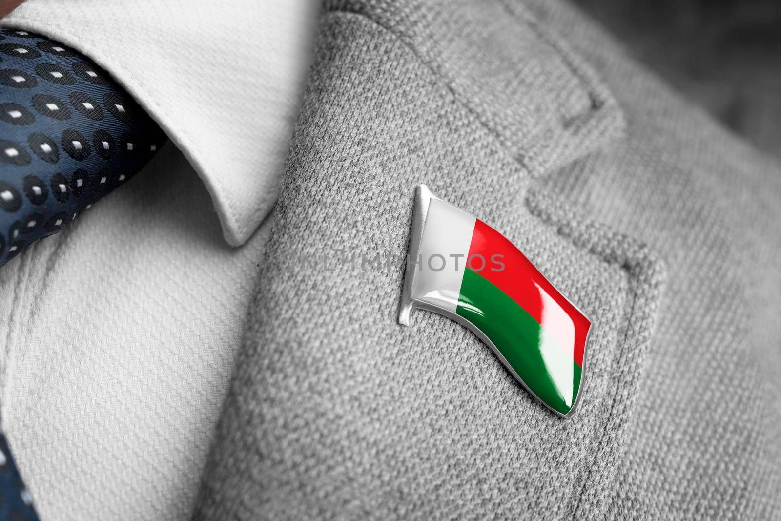 Metal badge with the flag of Madagascar on a suit lapel.