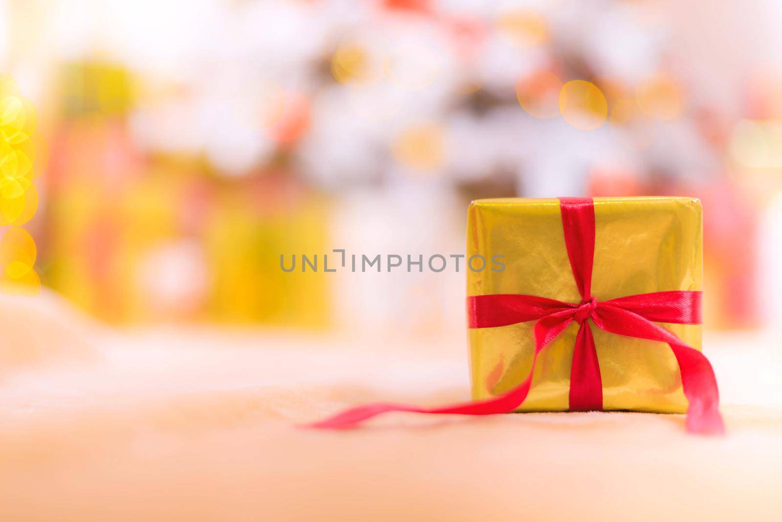 Golden gift banner . Copy space new year . Christmas. A gift for the holiday. The blur of the background. Article about the selection of gifts