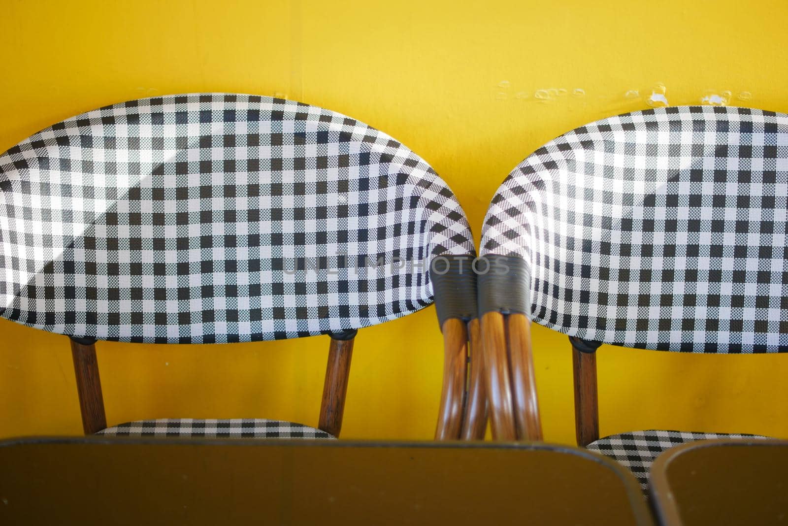 empty chair at cafe against yellow background ,