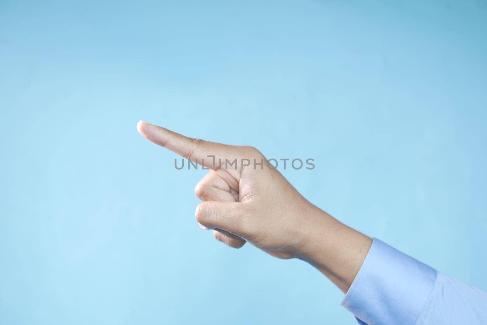 young businessman in suit point finger .