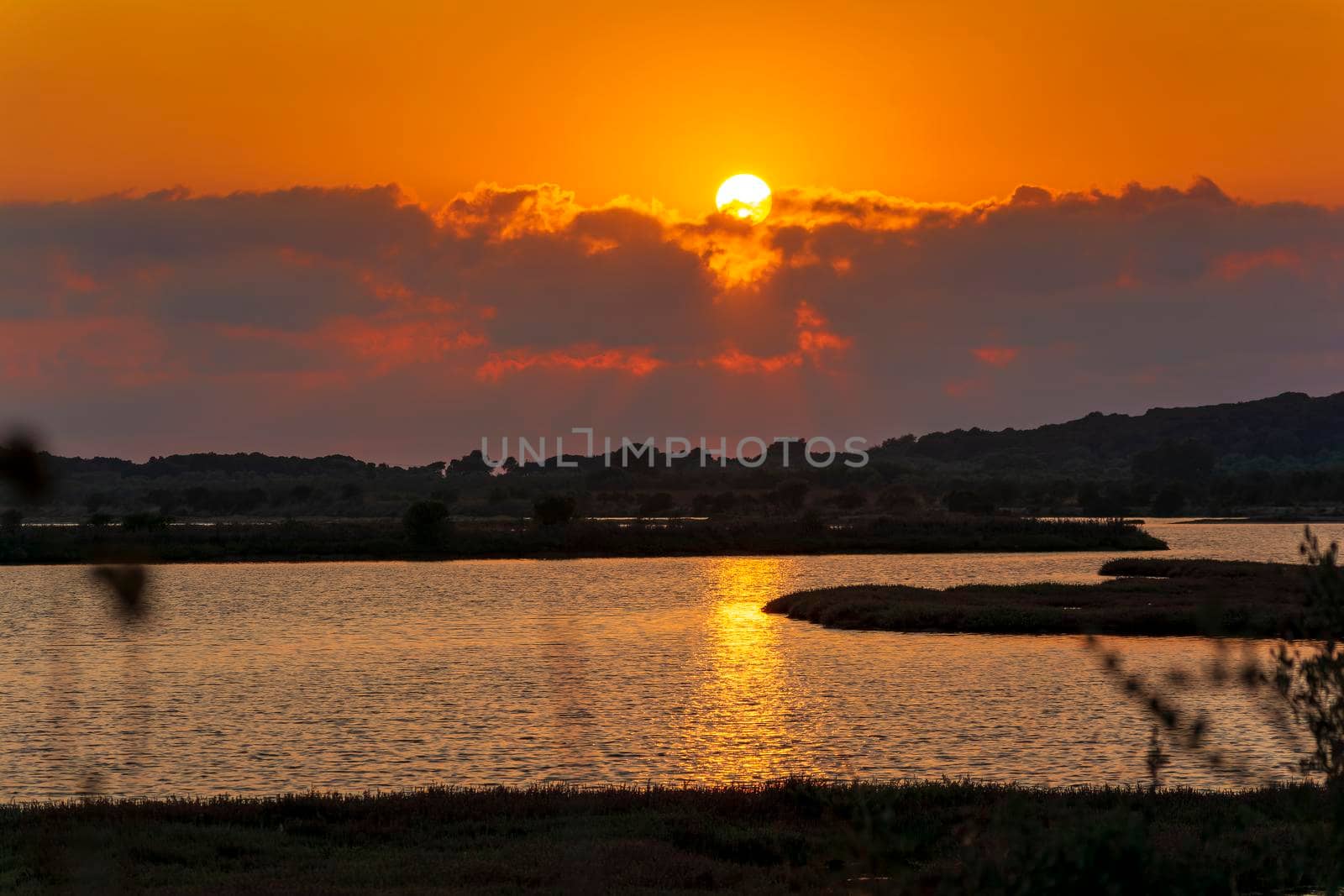 Sunset at the gialova lagoon. The gialova lagoon is one of the most important wetlands in Europe. by ankarb