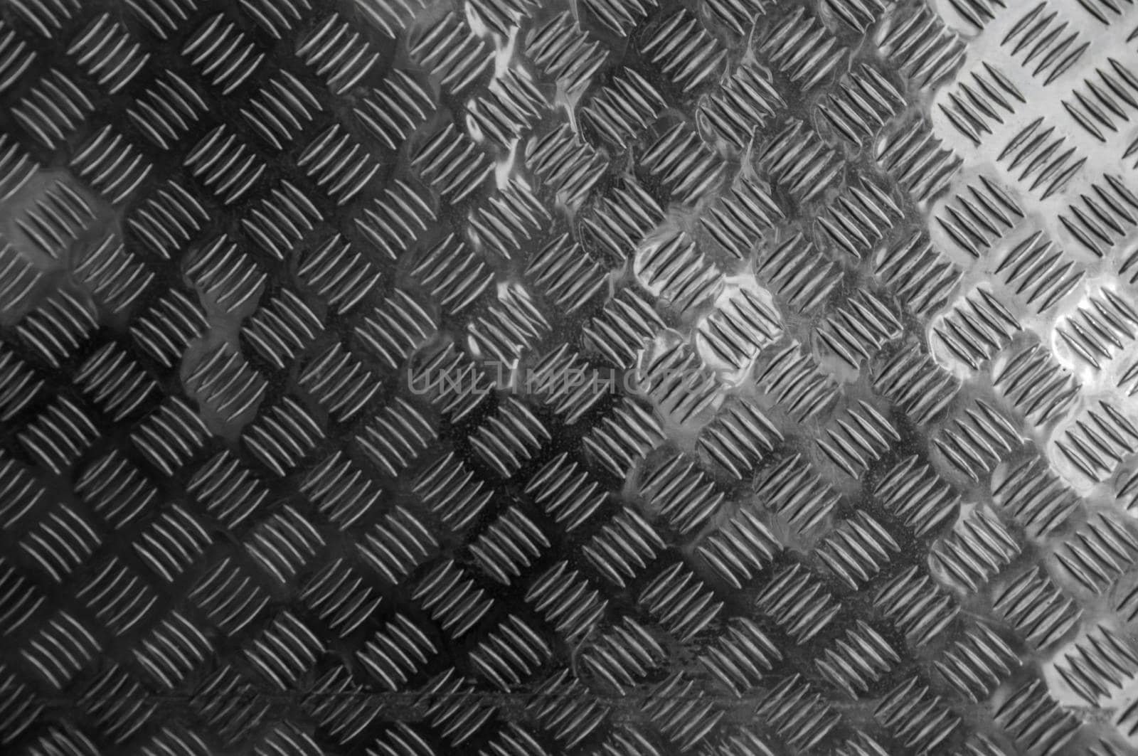Background of metal diamond plate in silver color. by inxti