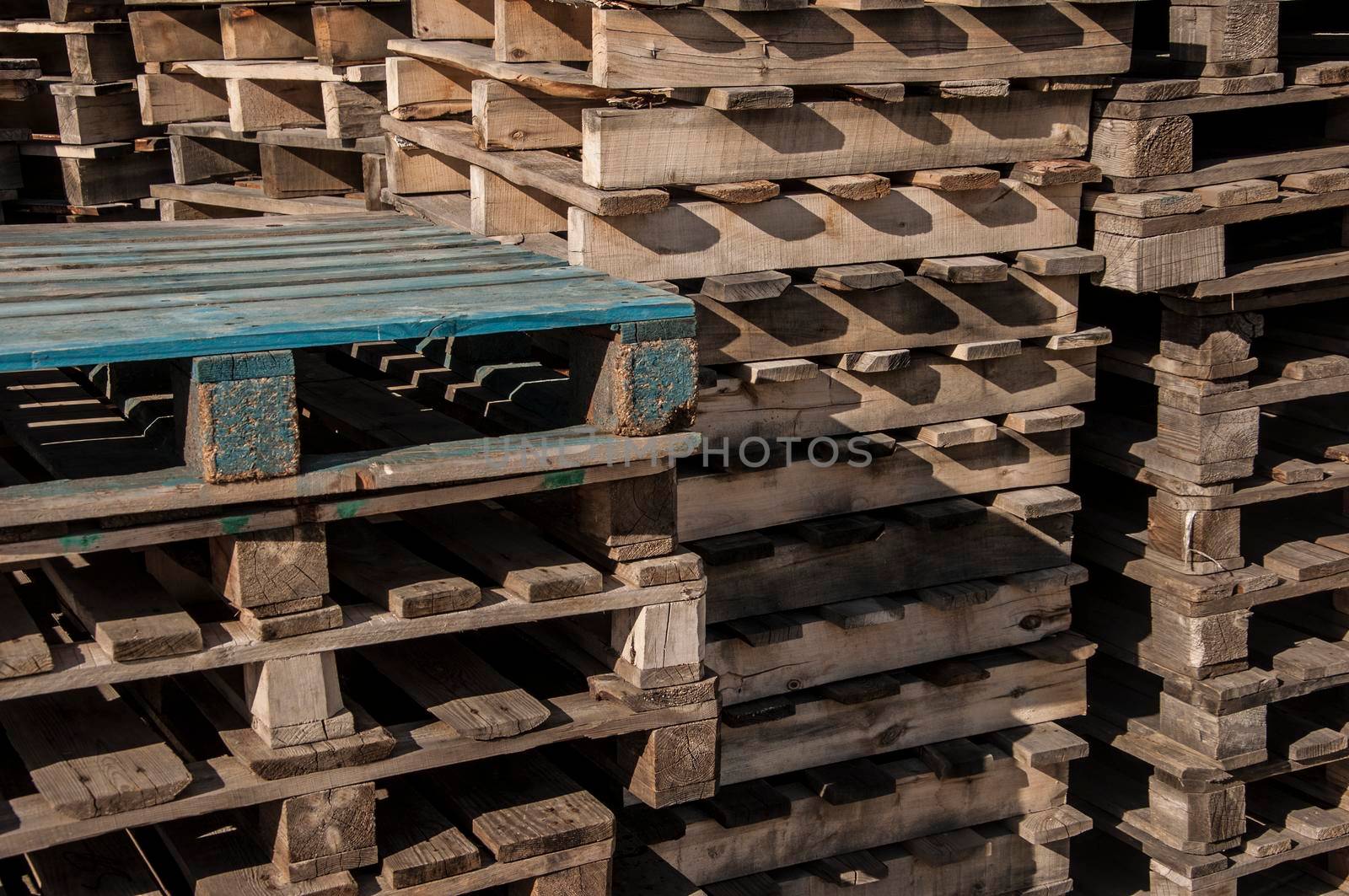 Big bunch of used wooden cargo pallets
