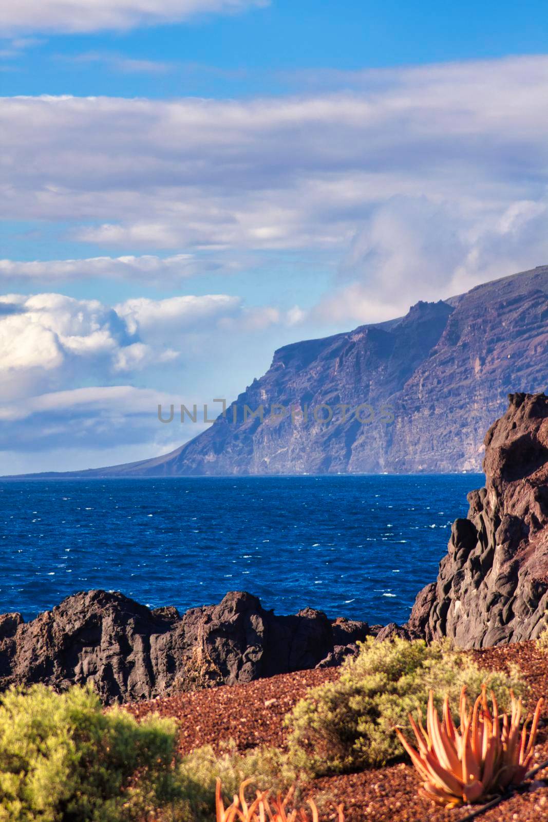 Los Gigantos at Tenerife with clouds and blue sky by Bullysoft