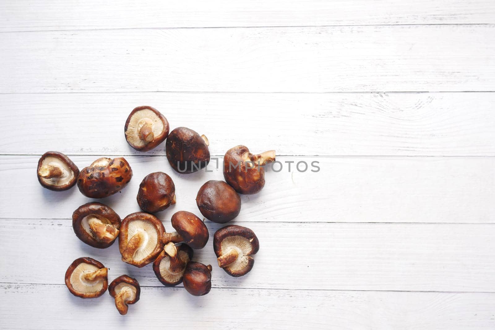 raw champignon mushroom on a white table ,