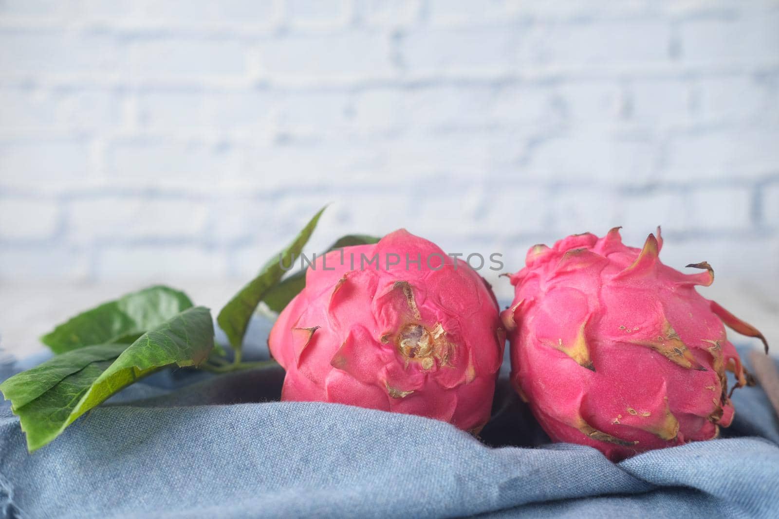 slice of dragon fruit on a chopping board.,
