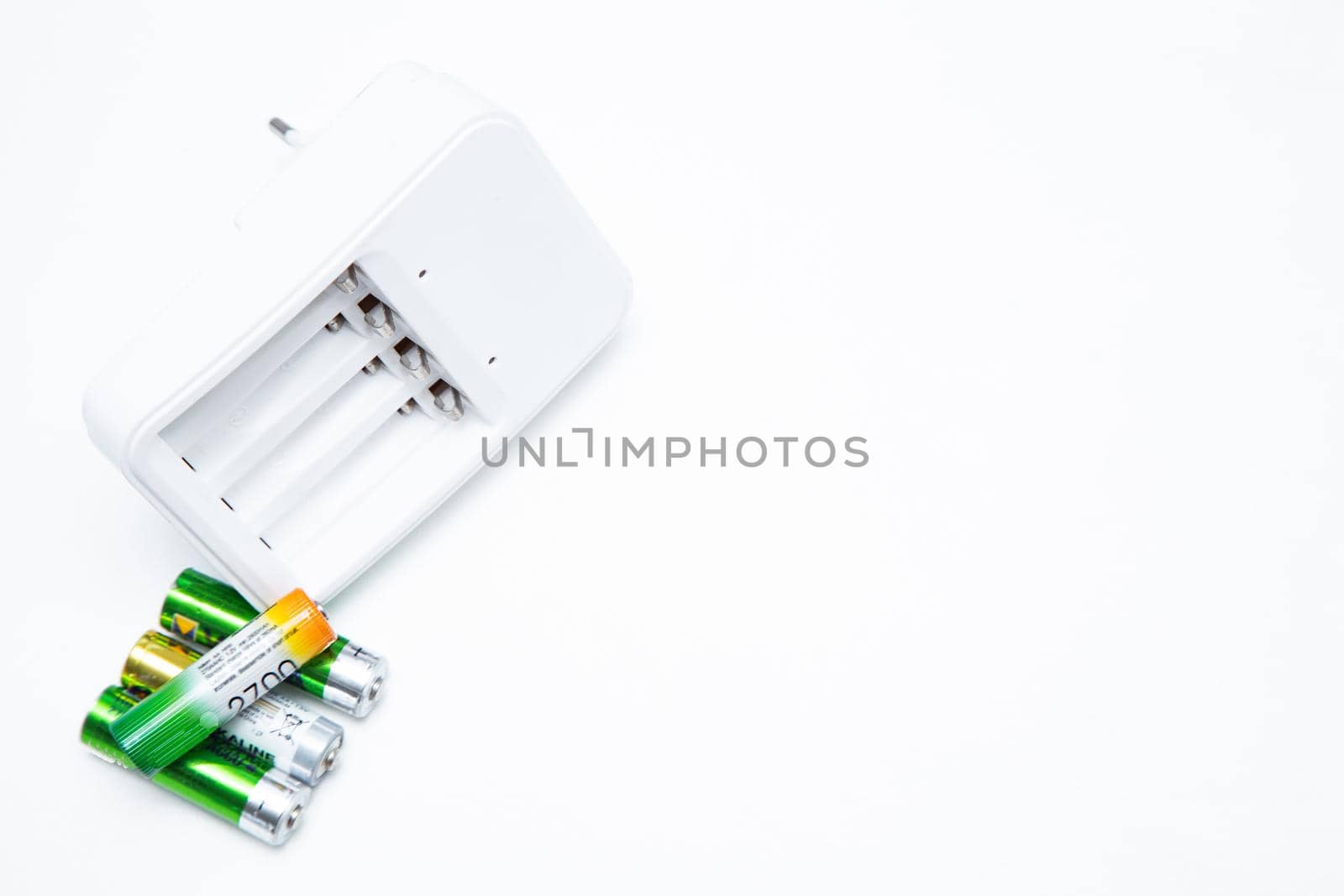 A small fixed lens for a professional camera lies sideways on a white background. High quality photo