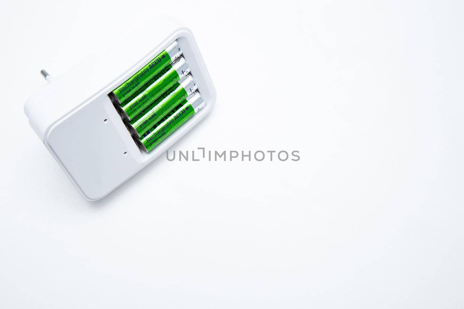 A small fixed lens for a professional camera lies sideways on a white background. High quality photo