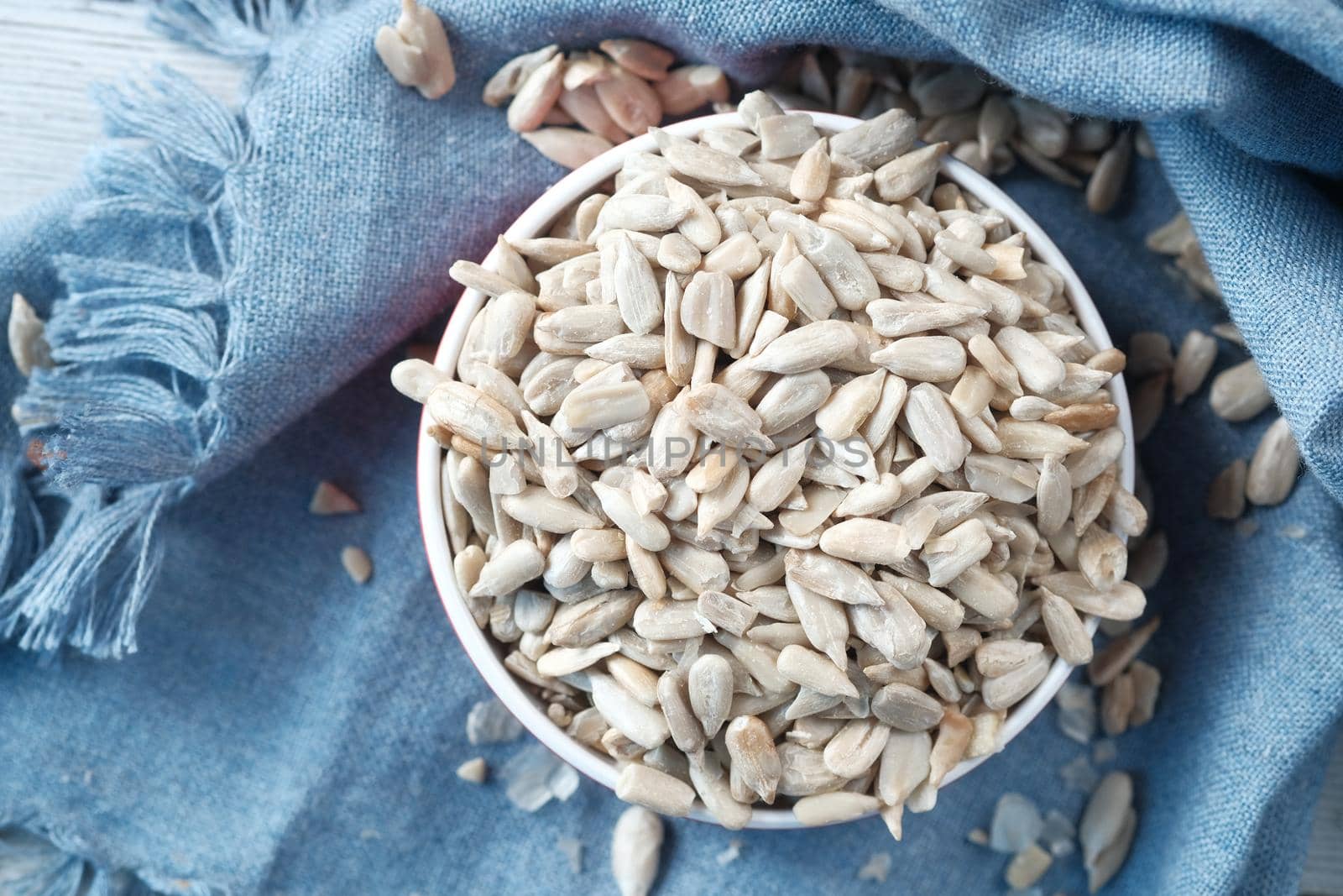 sun flower seeds in a bowl on table ,