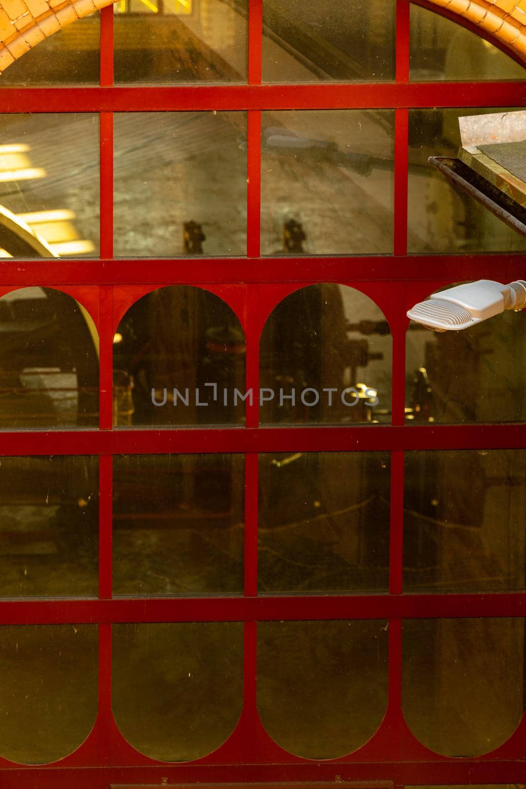 Big window with red frames of pumping station building