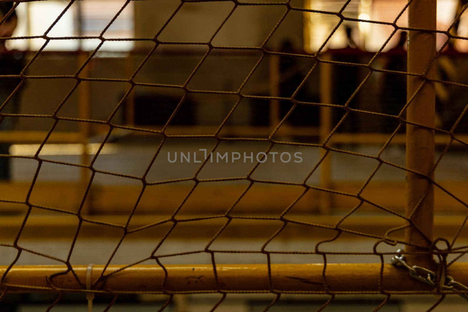 Yellow net in front of big hall with metal yellow railings by Wierzchu