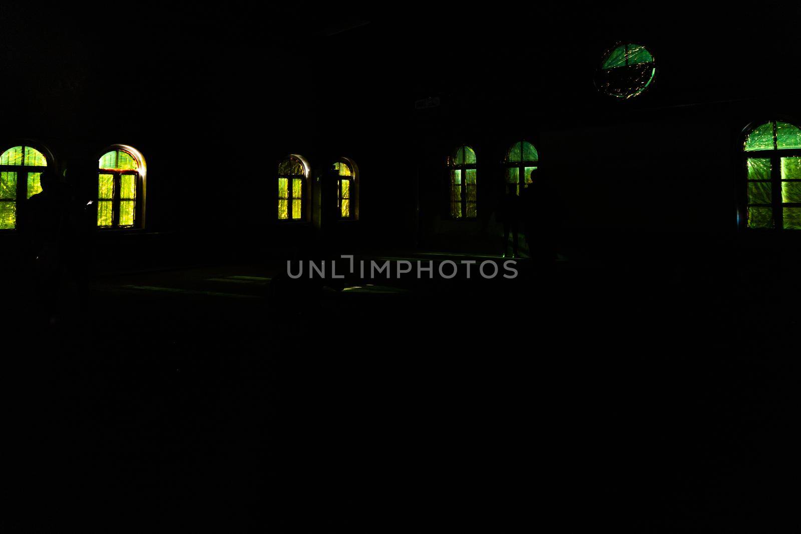 Dark big hall full of windows with yellow and green foil by Wierzchu