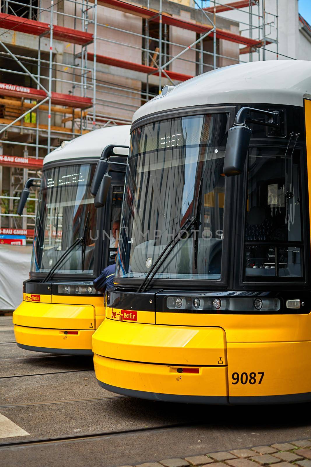 Tram terminal station. Modern trams are yellow. Berlin city transport. Berlin, Germany - 05.17.2019