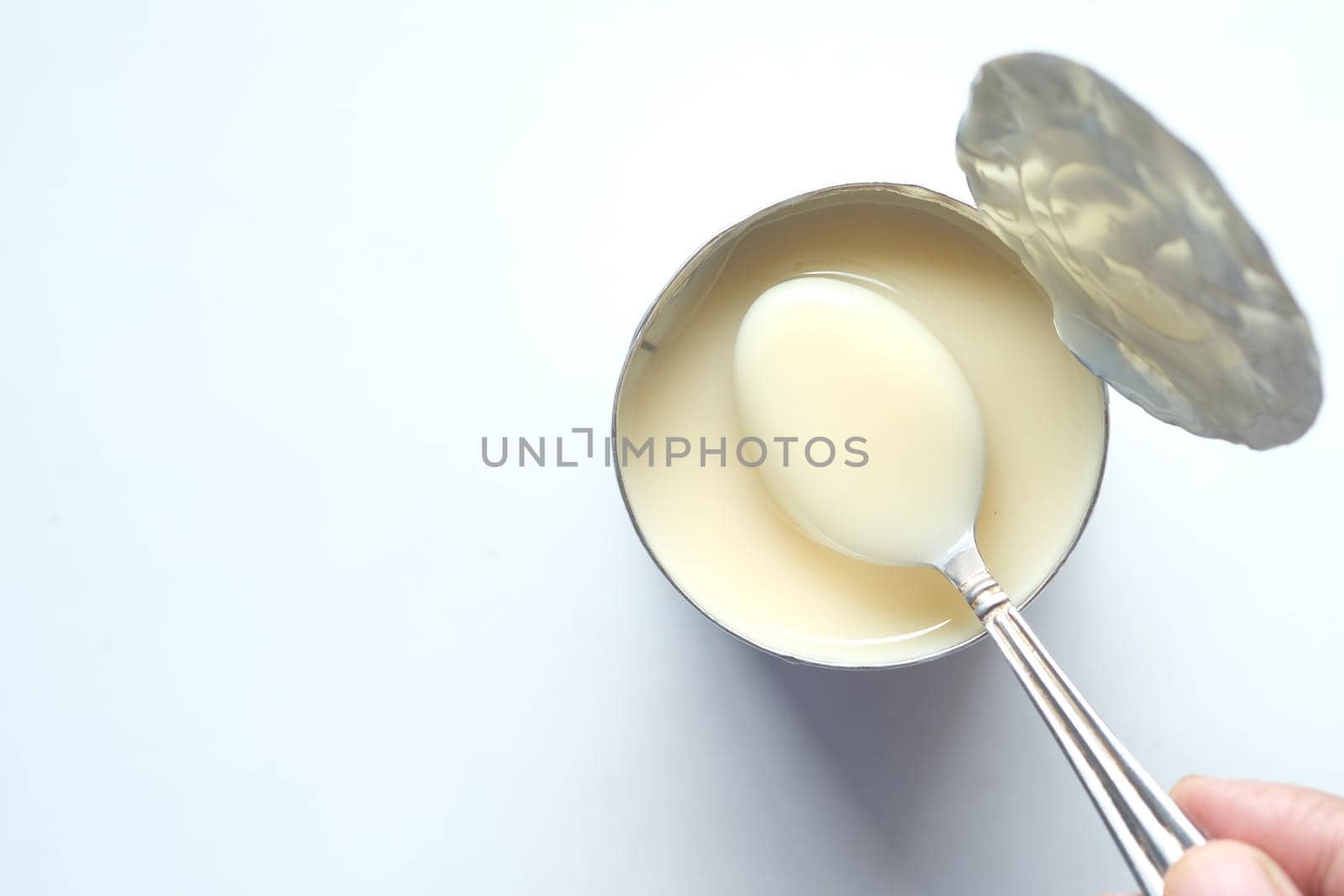 condensed milk in a bowl close up, by towfiq007