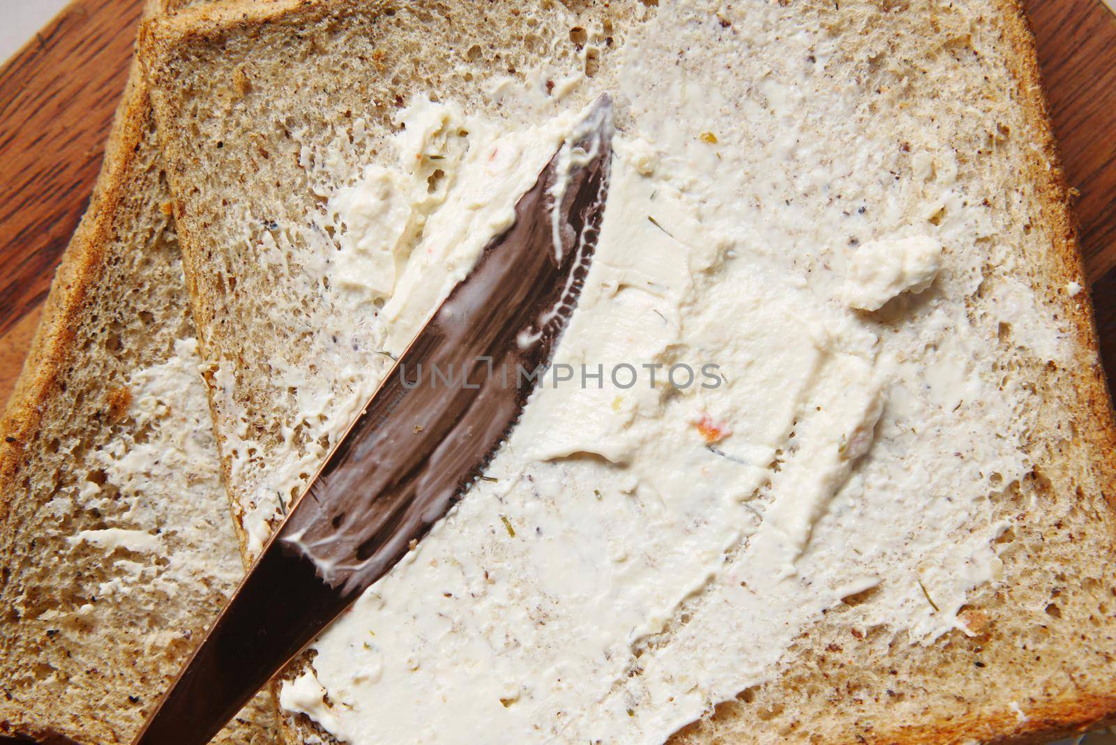 low fact cheese cream spread on a bread by towfiq007