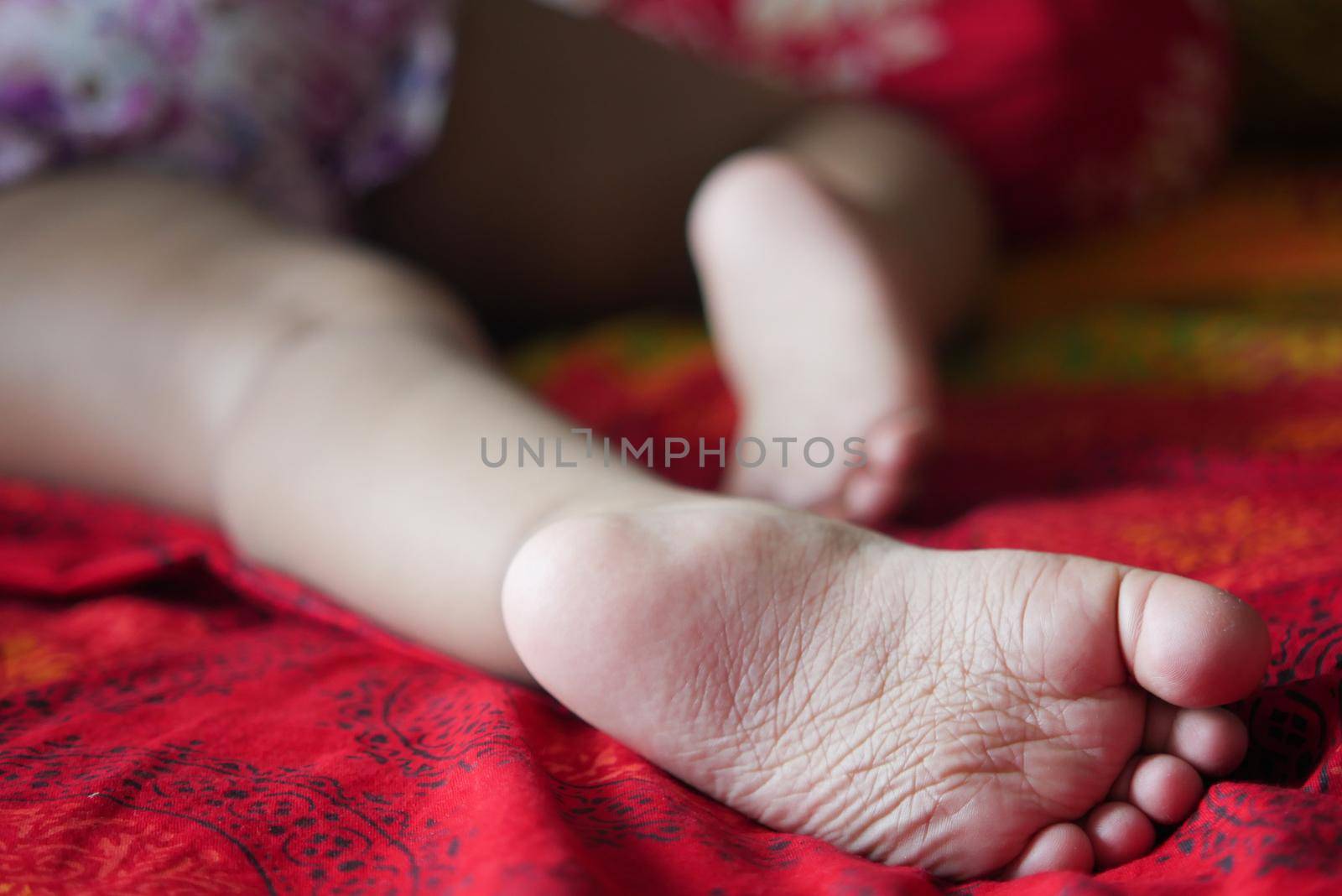 close up of dry child feet on bed , by towfiq007