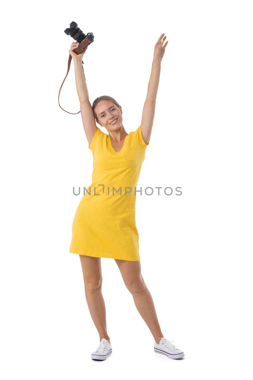 Woman photographer with arms raised by ALotOfPeople